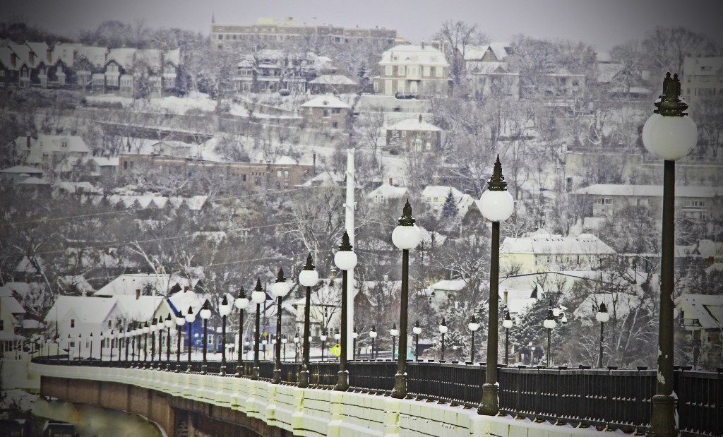 This is a shot of the High Bridge is St Paul, MN. In the lower left corner is a little blue house...